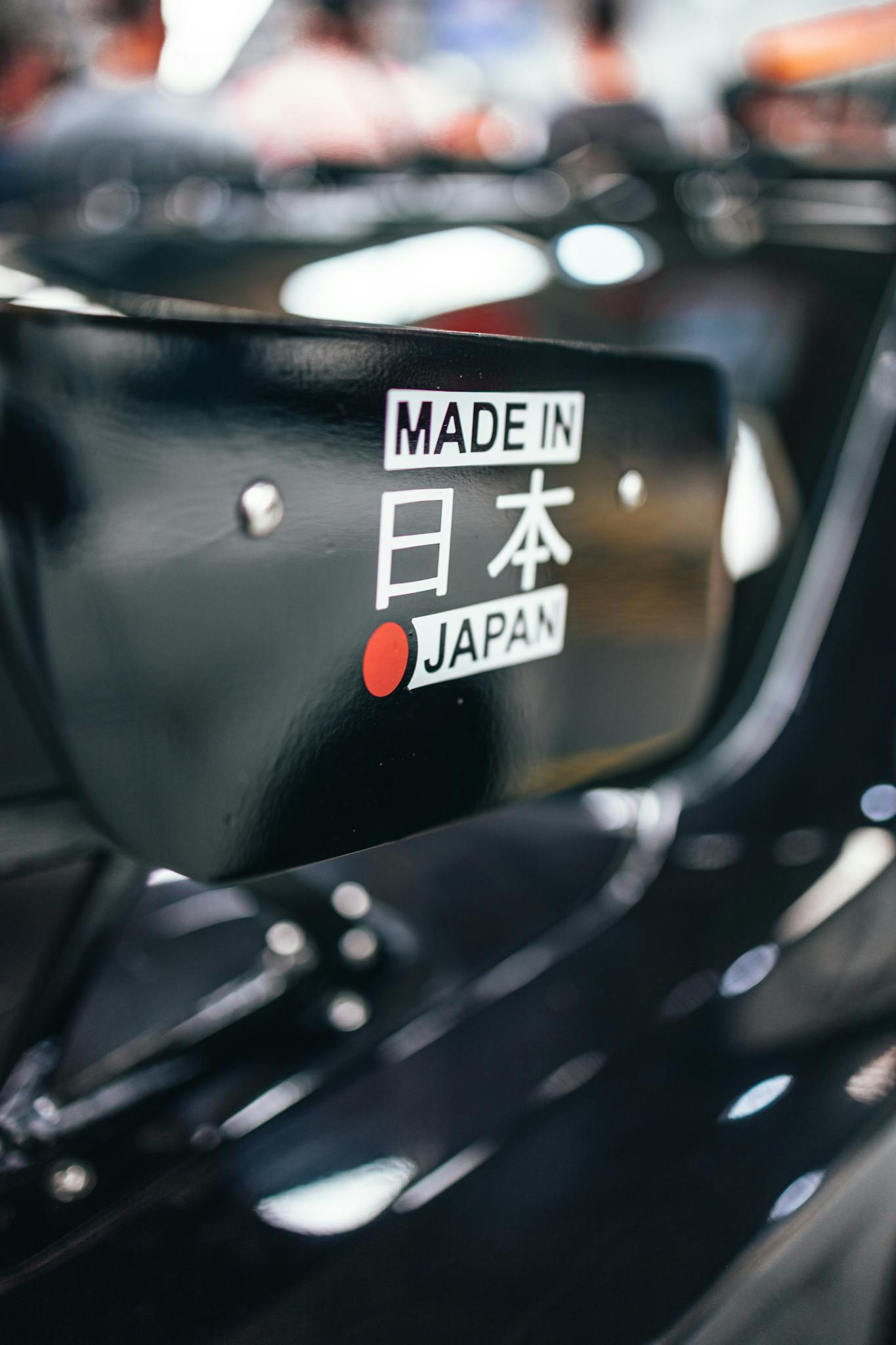Detail view of a car featuring a 'Made in Japan' label, emphasizing Japanese craftsmanship.